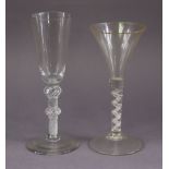 An 18th century drinking glass with tall narrow funnel bowl on double-knop airtwist stem, 20cm high;