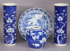 A pair of 19th century Chinese blue & white porcelain prunus pattern sleeve vases, 26cm high; a