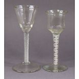 An 18th century wine glass with honeycomb-moulded ogee bowl, on opaque white twist stem with central