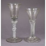 An 18th century wine glass with bell-shaped bowl, on double-knop opaque white twist stem with