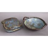 JOHN CALVER, a studio pottery lidded dish of asymmetrical shape with foliate decoration on a mottled