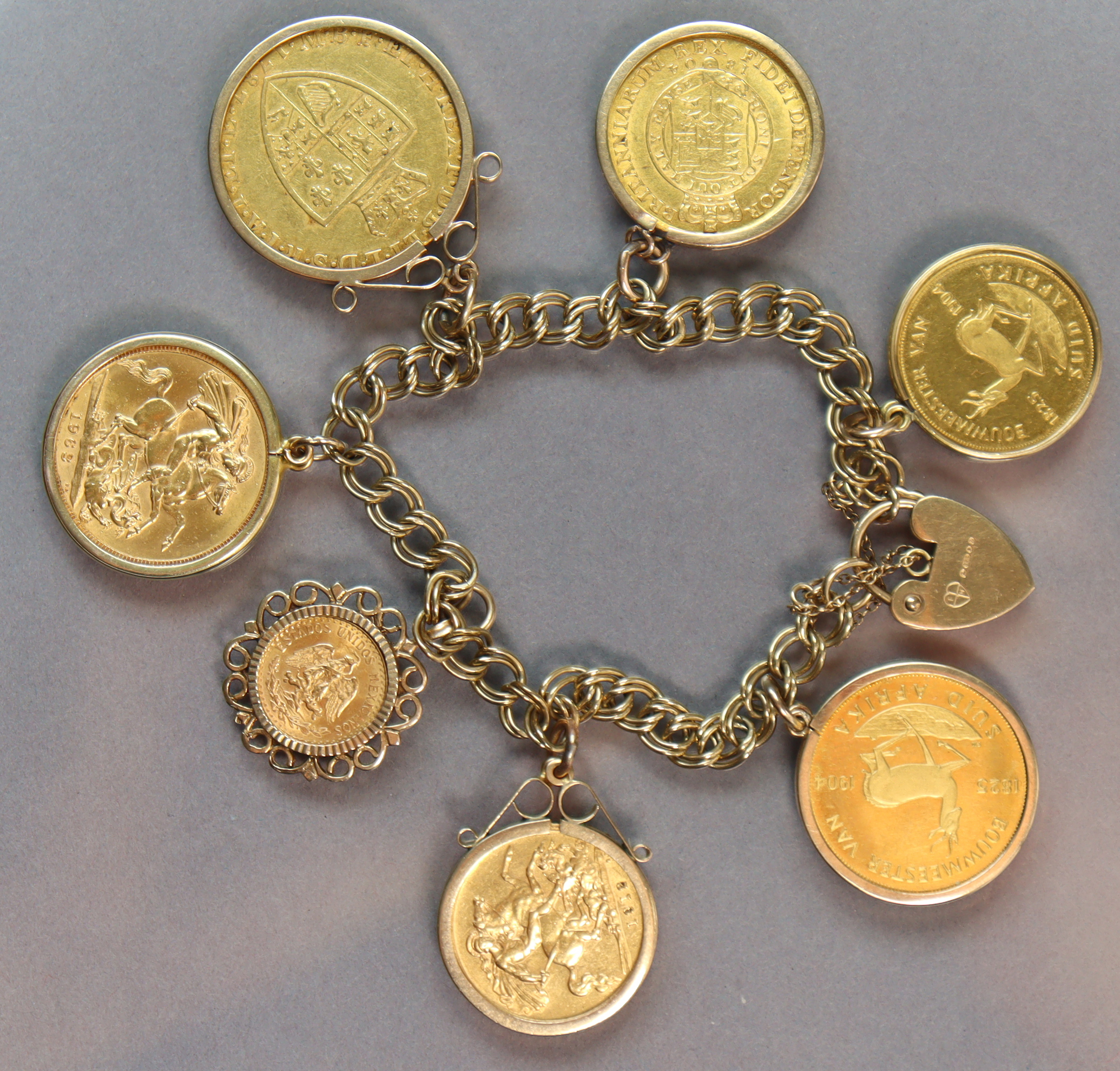 A 9ct. gold bracelet of double wire links & padlock clasp, with seven pendant gold coins: A George - Image 2 of 2