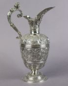 AN EARLY VICTORIAN SILVER ‘CELLINI’ WINE EWER with all-over repousse decoration of masks, animals,
