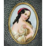 A late 19th/early 20th century continental porcelain oval plaque depicting a beauty, 2¼” x 1?”,