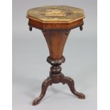 A Victorian rosewood octagonal needlework table, with hinged lid, tapered centre column & three