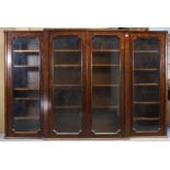 A 19th century walnut break-front bookcase, enclosed by four glazed panel doors & fitted an arrangem