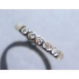 A 9ct. gold ring set row of small diamonds; size: P/Q; 2.1 gm.