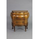 An 18th century style Italian walnut small bombé commode with marquetry decoration, fitted three