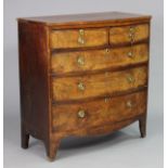 A Victorian mahogany bow-front chest fitted two short & three long graduated drawers with brass ring