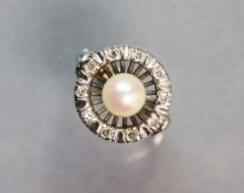 A white metal ring set cultured pearl with an open border of small diamonds; size: P; 5.5. gm.