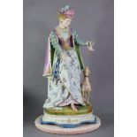 A mid-19th century Paris porcelain large figure group of a lady in 18th century dress feeding her