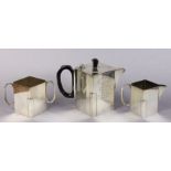 An Art Deco silver-plated three piece tea service of straight-sided lozenge shape, with engraved dec