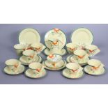 A CLARICE CLIFF “RAVEL” PATTERN POTTERY PART TEA SERVICE, with green & orange painted borders,