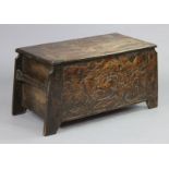 A late 19th/early 20th century Chinese carved elm trunk with all-over foliate decoration, of