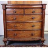 A Victorian mahogany large “Scotch” bow-front chest fitted with a cushion-moulded drawer above two