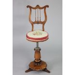 A William IV rosewood harpist’s chair with lyre-shaped spindle back, circular revolving seat on