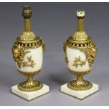 A pair of 20th century alabaster & gilt brass mounted table lamps in the19th century French style,