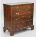 A George III oak chest fitted two short & three long graduated drawers with brass swan-neck handles,