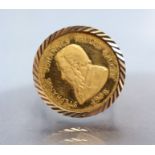 A 9ct. gold ring set 9ct. gold coin commemorating the life of Paul Kreuger (1825-1904); size: R/S;
