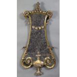 A 20th century carved giltwood wall mirror in the Adam style, of lyre shape with ram’s heads, husk-