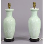 A pair of 20th century Chinese porcelain celadon-glazed baluster vases forming table lamps, each