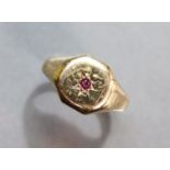A 9ct. gold ring gypsy-set small ruby; size: S; 4.8 gm.