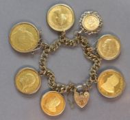 A 9ct. gold bracelet of double wire links & padlock clasp, with seven pendant gold coins: A George