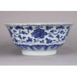 A Chinese blue & white porcelain bowl, decorated with trailing lotus flowers above a lappet border