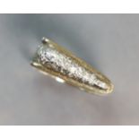 A yellow 14K modernist ring of open rectangular form, the wedge-shaped head set numerous small