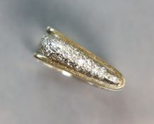 A yellow 14K modernist ring of open rectangular form, the wedge-shaped head set numerous small