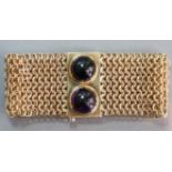 A 14K MESH BRACELET, the broad chain mesh band set two large amethyst cabochons to the solid