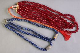 Two lapis lazuli bead necklaces, each with a focal Venetian millefiori glass bead; & a multi-strand