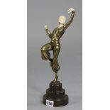 A reproduction bronzed & ivorine dancing female figure, on a stepped round base (left hand w.a.f),