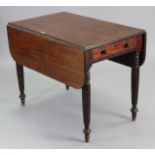 A 19th century mahogany Pembroke table fitted with an end drawer, & on turned & fluted tapering