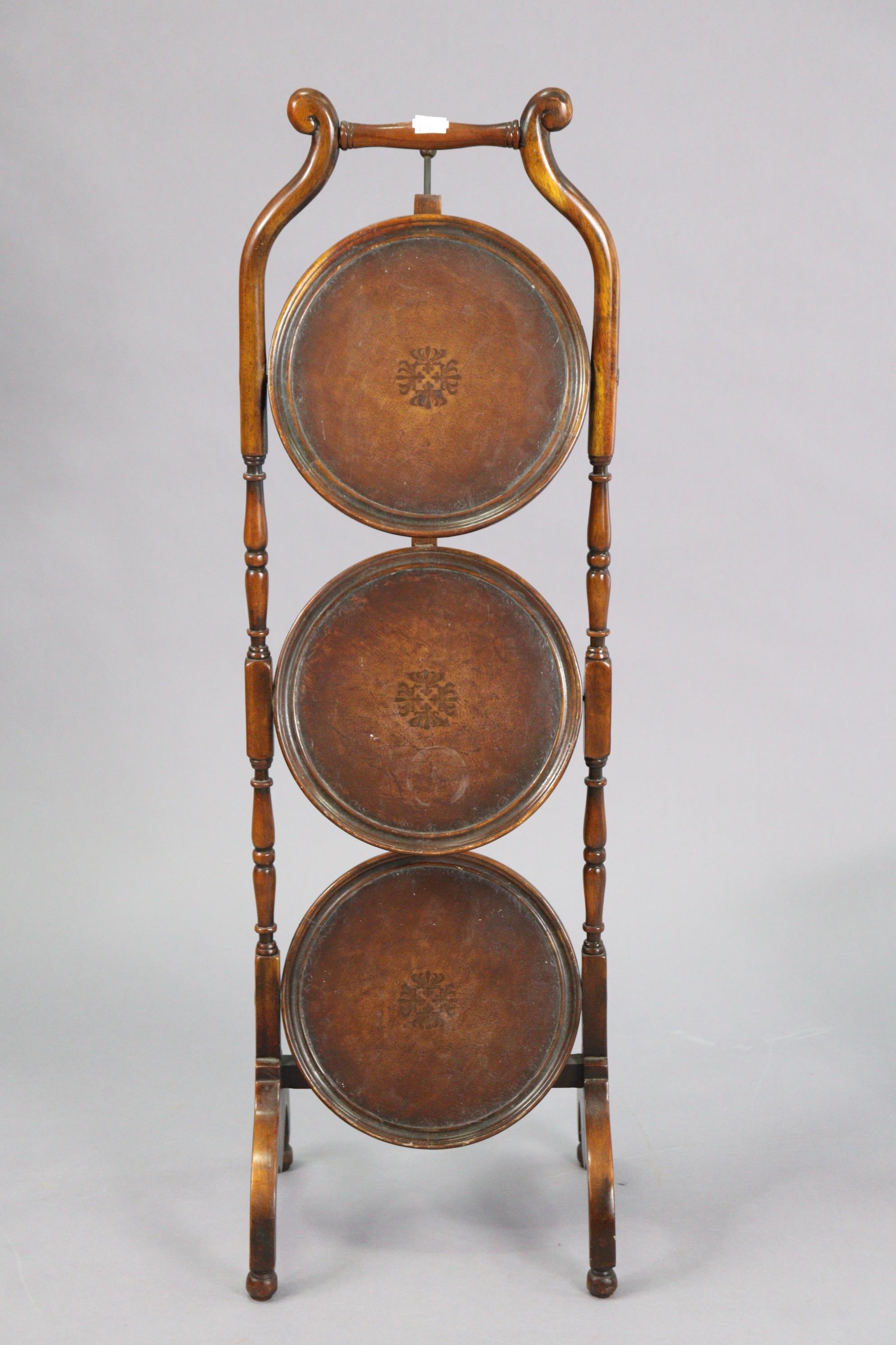 A carved wooden oval wall mirror inset with a bevelled plate, 21” x 15¼”; together with a three-tier - Image 4 of 5