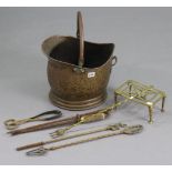 A brass coal scuttle, 10” high, a brass trivet, 7¾” wide; & six various fire-implements.