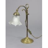 An Edwardian brass desk lamp with shaped glass shade, on adjustable column & circular base, 17½”