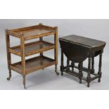 A 1930’s oak three-tier tea trolley on square supports with castors, 29¾” wide x 36” high x 17¾”