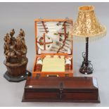 A Brexton picnic set with an orange fibre-covered case; a carved treen large figure group