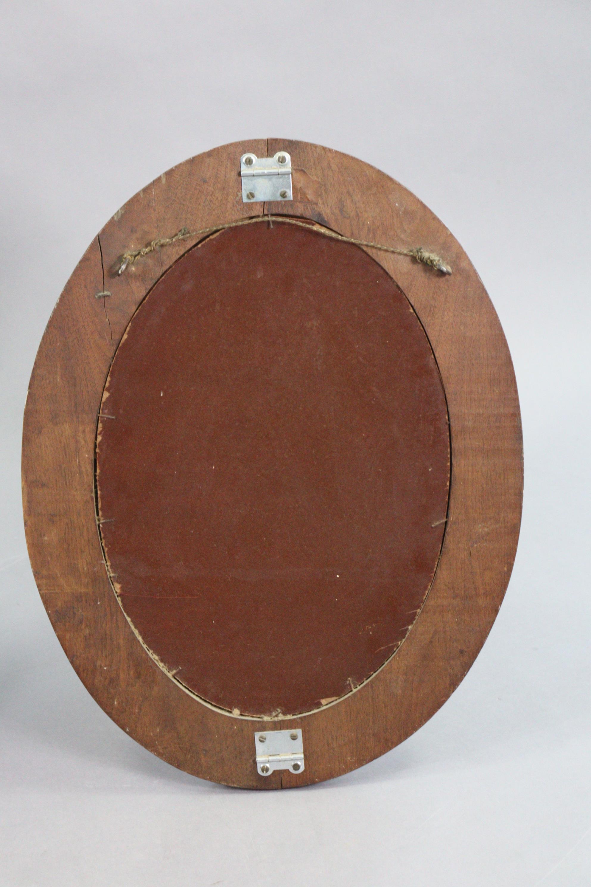 A carved wooden oval wall mirror inset with a bevelled plate, 21” x 15¼”; together with a three-tier - Image 3 of 5