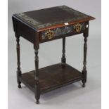 A Late 19th/early 20th century carved oak side table fitted with a frieze drawer having drop-leaf to