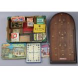 A Corinthian “21T” bagatelle board; & various assorted games & jig-saw puzzles.