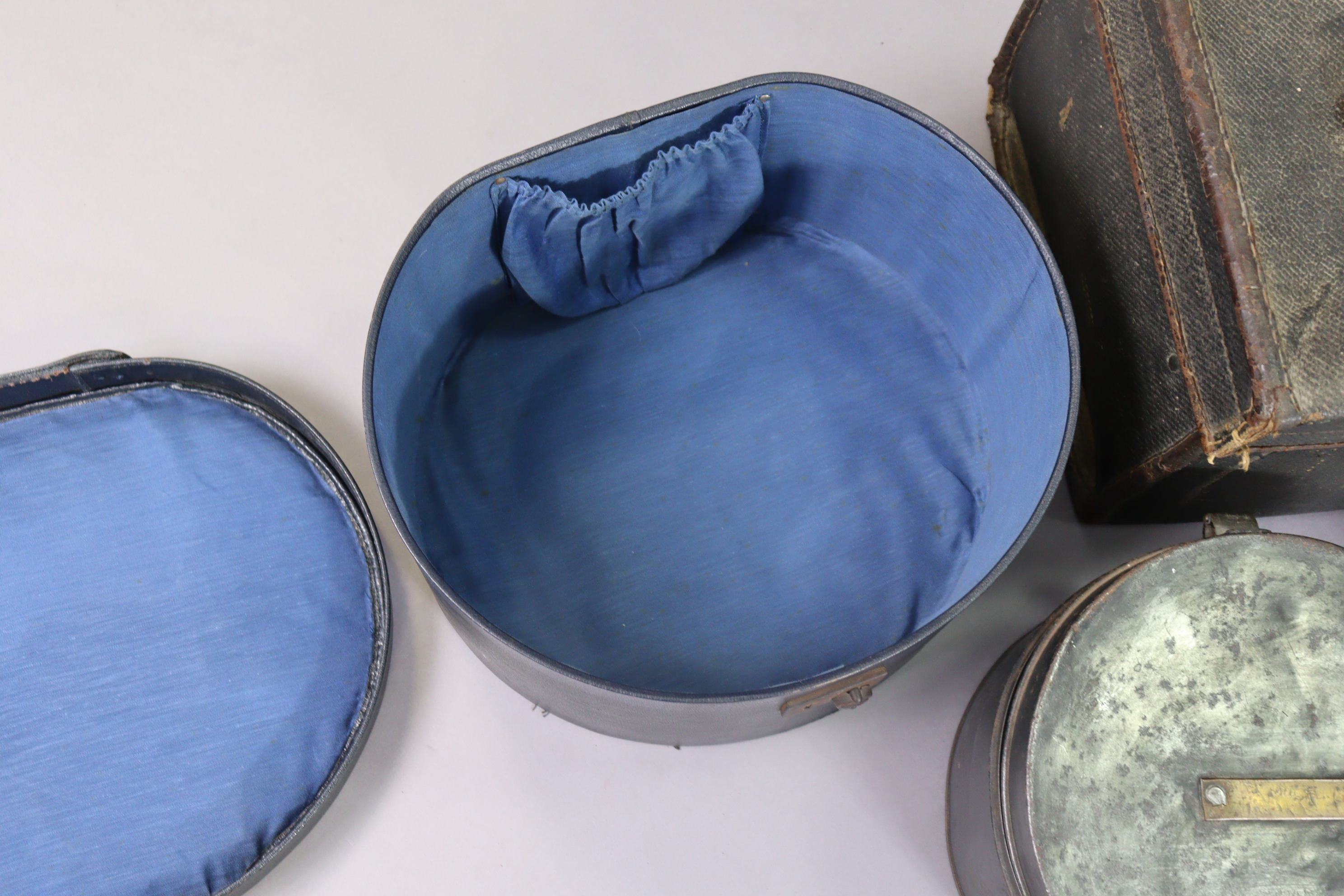 A vintage japanned-metal hatbox, 26.5cm diameter; together with another hatbox; a tan leather - Image 3 of 5