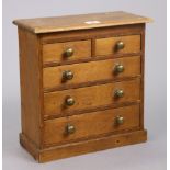 An early 20th century pine collector’s chest fitted two short & three long graduated drawers with