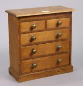 An early 20th century pine collector’s chest fitted two short & three long graduated drawers with