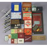 A modern Meh-Jong set, cased; together with various vintage board games, sets of playing cards,