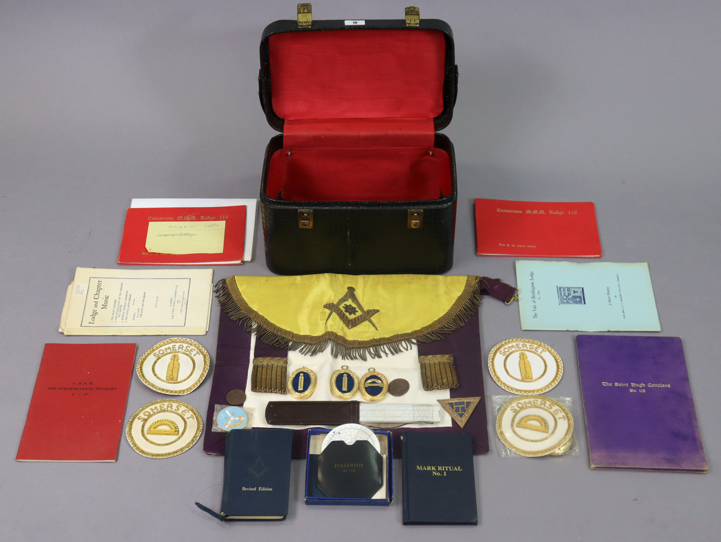 A Masonic regalia apron; & various ditto embroidered cloth badges, books, etc.