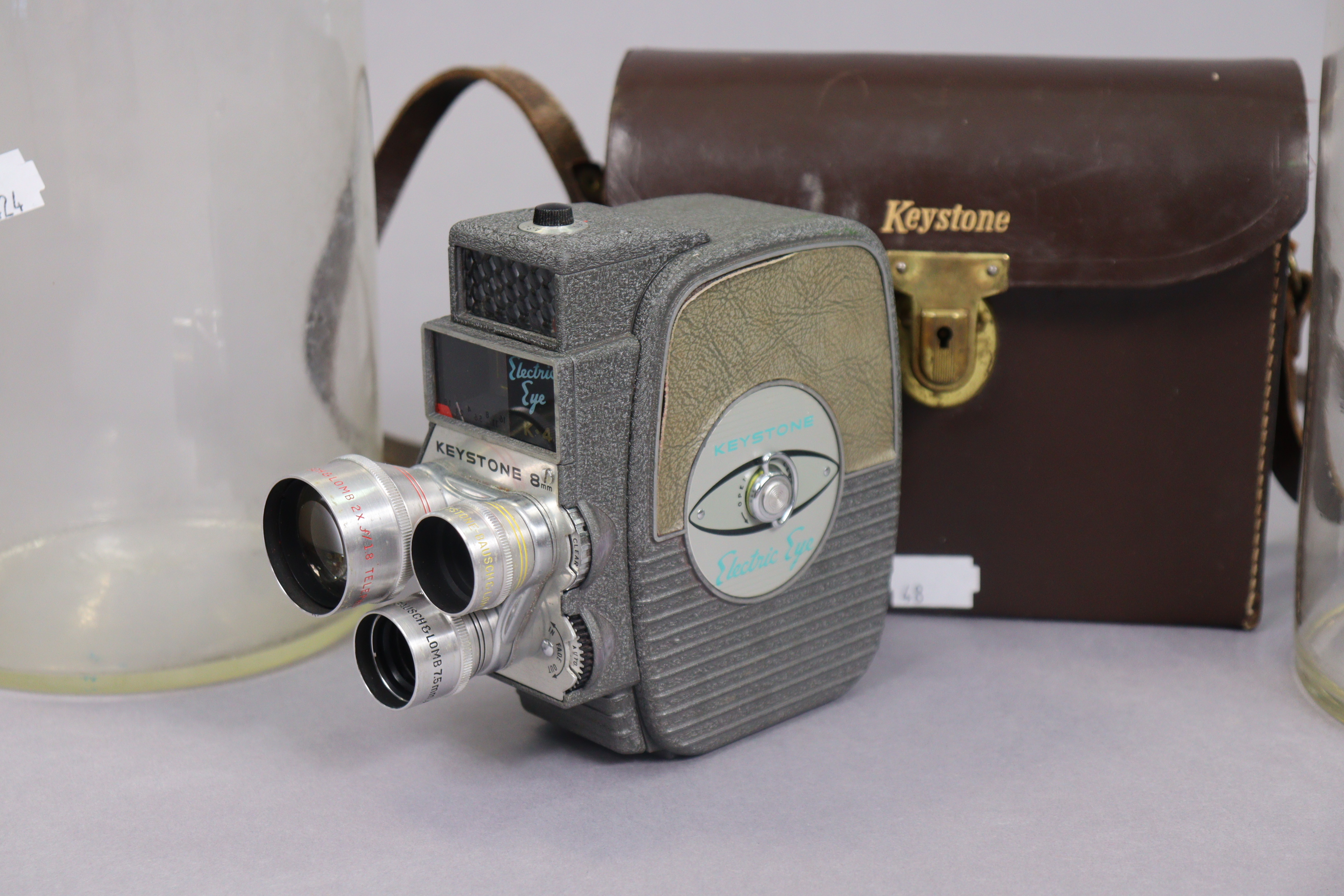 A Keystone “Electric Eye” 8mm cine-camera, with case; & a pair of clear glass cylindrical storage - Image 4 of 4