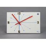 A mid-20th century French Flash Formica battery-operated wall clock, 17cm x 27cm.