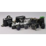 A Houghton-Butcher folding camera; two Zenit cameras; & a Zenit camera lens, all cased.